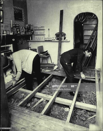 Stan in uniform early 70's digging under the house of Sydney gangster Stewart John Reagan searching for bodies.